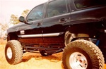 N-Fab's Wheel-to-Wheel Nerf Steps for '95-'99 Chevy/GMC Tahoe 4-Step