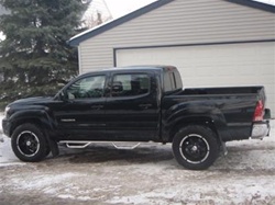 N-Fab's Stainless Steel Wheel-to-Wheel Nerf Steps for '05-'09 Toyota Tacoma Crew Cab 2" Main Tube (4 Full Doors)