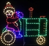 Mrs. Claus driving Tractor