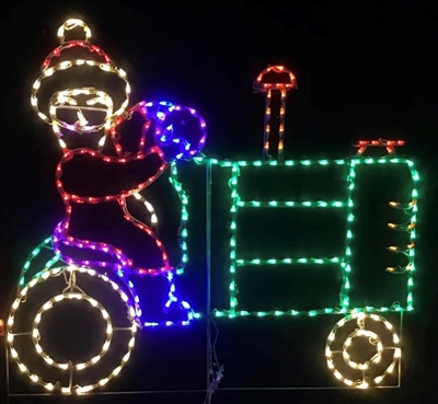 Mrs. Claus driving Tractor