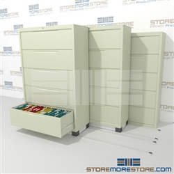 This Lateral File Cabinet storage system condenses and compacts filing cabinets together to save filing storage floor space and provide more space for more files or desks and other equipment to generate revenue.