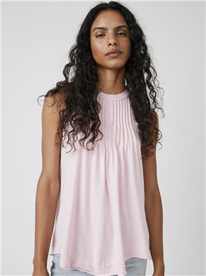 Pink cotton tank top in a trapeze silhouette with pleats on chest and raw hem.
