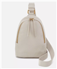 Women's cream leather small one strap sling handbag with gold zipper.
