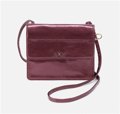 Ladies metallic iris Leather crossbody handbag with an adjustable strap.