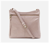 Women's pink leather crossbody handbag with adjustable strap