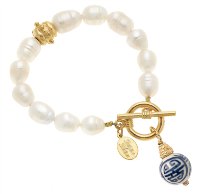 Ladies white freshwater pearl bracelet with hand painted blue and white porcelain ball