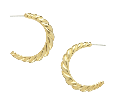 Women's gold hoop earrings.