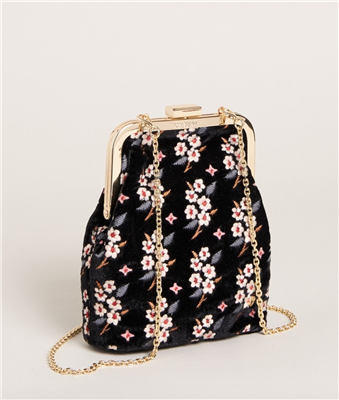 Women's black embroidered crossbody bag with gold chain strap that can be removed to carry as a clutch.