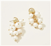 Women's gold pearl cluster earrings.