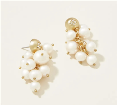 Women's gold pearl cluster earrings.