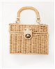 Women's tan straw box purse with gold hardware with clasp closure