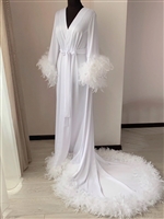 Luxurious robe with feathers and a train for the bride