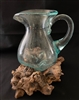 Glass pitcher on Driftwood