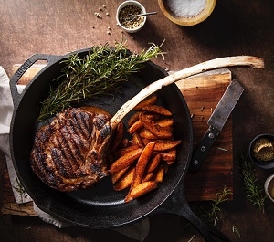 Bison Tomahawk steaks are exceptionally large ribeye steaks with an extra-long frenched bone. Our Bison Tomahawk steak weighs an average of 22 to 32 oz.