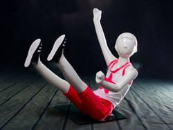 Child Mannequin Sitting and Waving in White