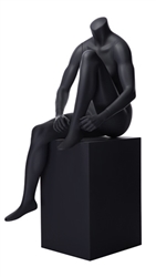 Matte Grey Headless Female Mannequin.  Athletic form great for displaying activewear. She is sitting on a stool, tying her shoes.