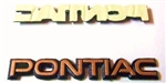 Image of 1987 - 1990 Gold Headlamp PONTIAC Nose Emblem for Trans Am, GTA & Turbo Trans Am