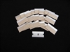 Large array of stainless steel single edge razor blades with paper edge protectors