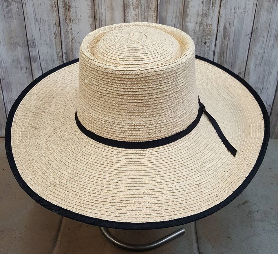 4 Inch Brim, telescoped 4-1/4 Inch crown (creased), with a bound-edge. Brim  dips in front and curves up in back. Guatemalan standard palm. Other brims  available. Cowboy hats. Nevada style