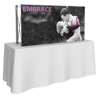 Embrace 2x1 popup trade show booth with front dye-sub SEG fabric graphic perfect for table top displays