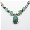 Vibrant Mint Necklace photo. Like the Lemongrass Drop necklace, its structure is silver, however this one is shorter. With a drop-like center chalcedony and other round chalcedonies on the sides. Detailed silver hoops come after the stones on the sides.