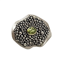 Handmade Ring made of sterling silver and 18k gold with peridot.
