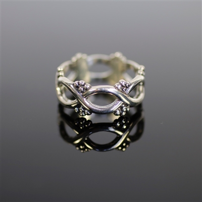 Elizabethan Ring photo. Polished- all silver band ring composed of all infinity- shape designs and little dots like flowers. Delicate and dainty.