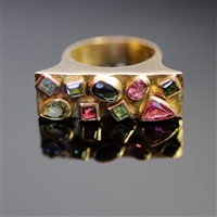 Zimbabwe Chic Ring. Same collection as Zimbabwe Chic Bracelet. This ring is the exact same design and stones and outline as the bracelet with the pink, blue, and green tourmalines of different shapes. 18k yellow gold, always of the best quality of course.