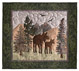 Quilt block of a mama and baby moose in the mountains.