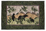 Quilt block of black bear cubs playing near a huckleberry bush, in the mountains.