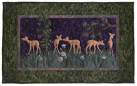 Quilt block of fawns playing in a meadow.