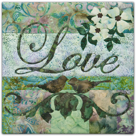 Quilt block with the word "Love," stylized flowers and birds in purple, blue, and green floral patterns.