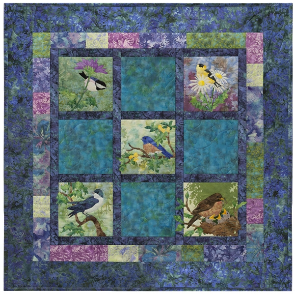 Pieced quilt block with appliqued morning birds.