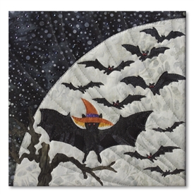 Quilt block of a bat showing off its costume before catching up with the other bats, in front of a large moon