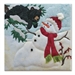 Quilt block of a snowman melting on a bright day, with a bear in a tree