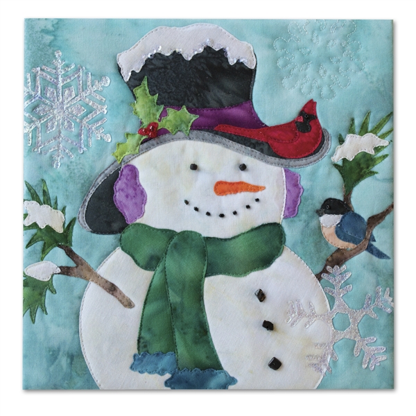 Quilt block of a smiling snowman wearing a hat and scarf, while a cardinal and a blue bird perch on him