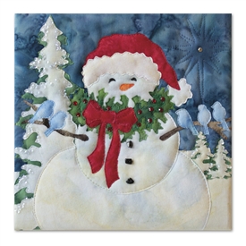 Quilt block of a snowman caroling with armfuls of blue birds
