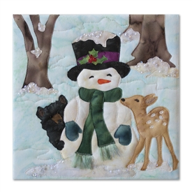 Quilt block of a bear cub and a fawn cuddling with a snowman during the chilly first frost
