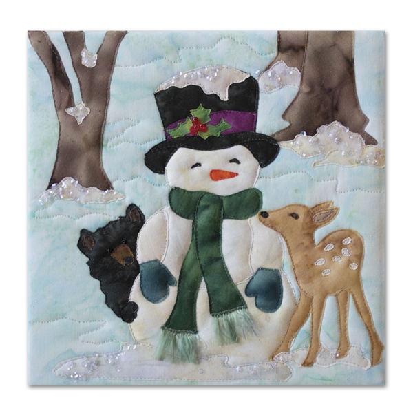 Quilt block of a bear cub and a fawn cuddling with a snowman during the chilly first frost