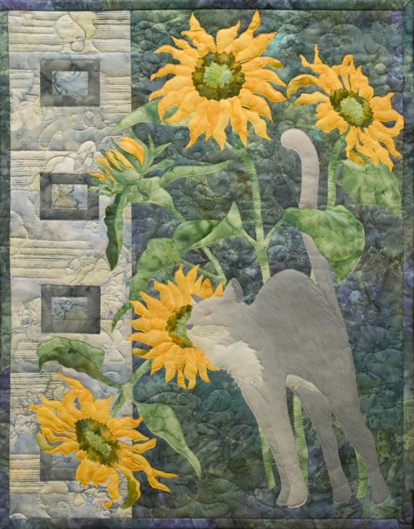 Quilt block of a Russian Blue (gray) cat, nuzzling a bunch of sunflowers