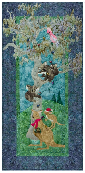 Quilt block of kangaroos, koalas, and a cockatoo decorating a gum tree with lights.
