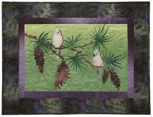 Quilt block of a titmouse being serenaded by her paramour, on the branch of a pine tree.