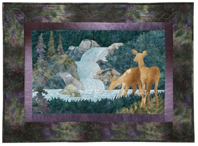 Quilt block of a doe with her fawn carefully drinking from the stream below a small waterfall.