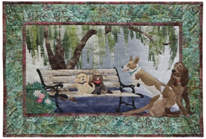Quilt block of five dogs taking a time out on a park bench.