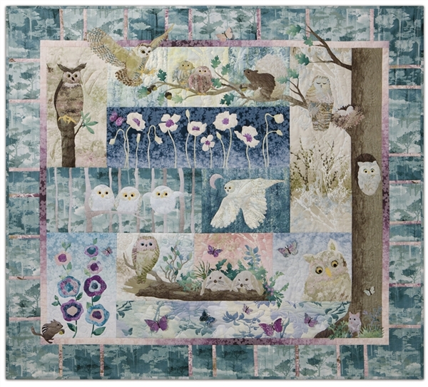 Quilt showing  family of owls in one corner of a forest, with neighboring chipmunks, squirrels, and bunnies.