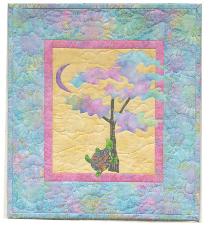Quilt block of Turtle from block one taking a nap under a tree with the moon overhead