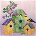 a fabric panel with a birdhouse and two finches