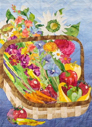 Quilt block of a basket of freshly harvested produce and flowers from an abundant garden.