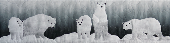 a single block quilt with an arctic snowy scene and polar bears