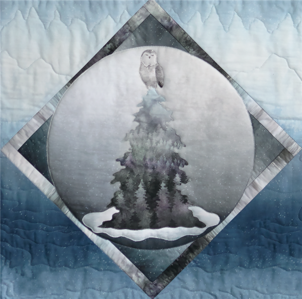 a single block quilt with an arctic snowy scene, with an owl in a tree